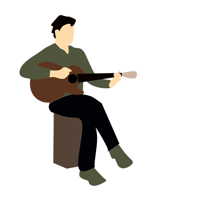 A Man Sitting On A Stool Playing A Guitar