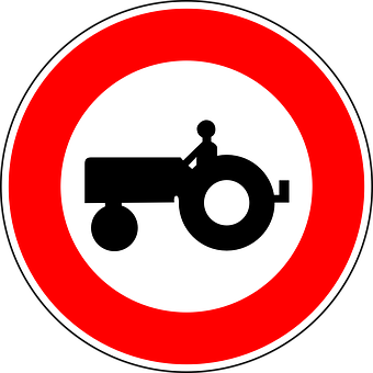 A Sign With A Tractor In The Middle