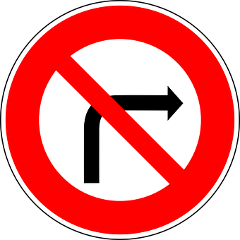 A Red And White Sign With A Black Arrow