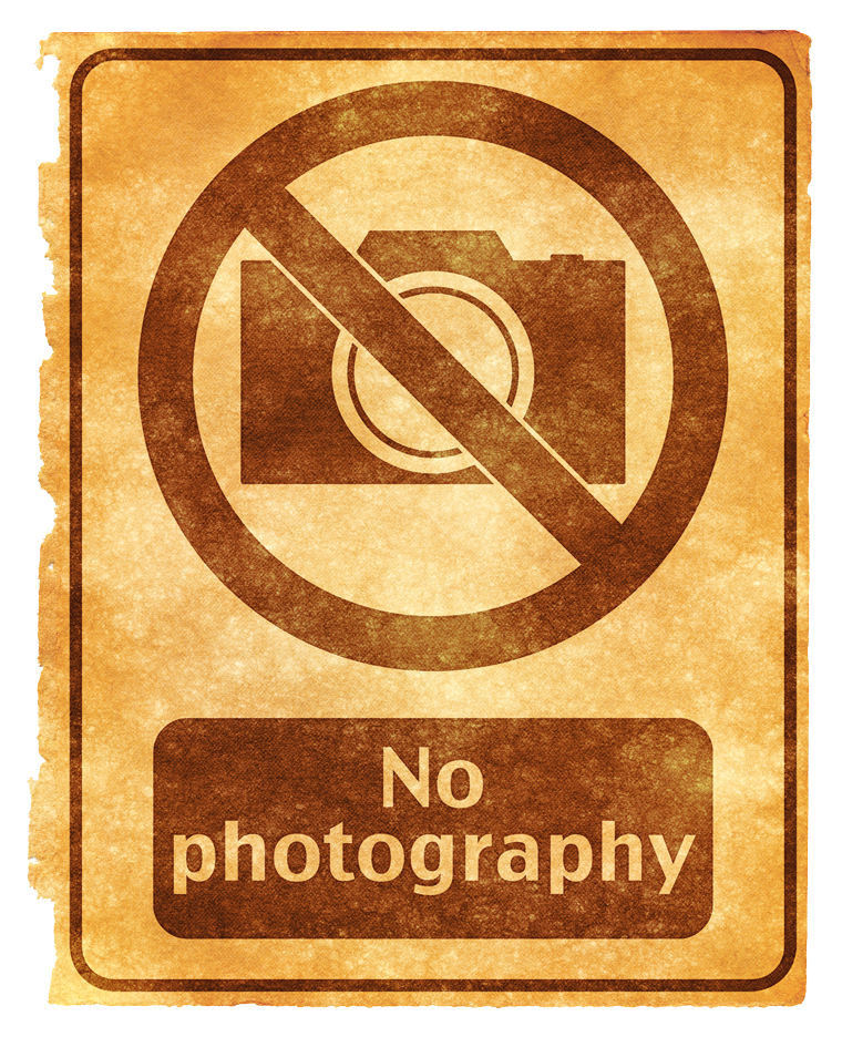 A Sign With A Camera And A Circle