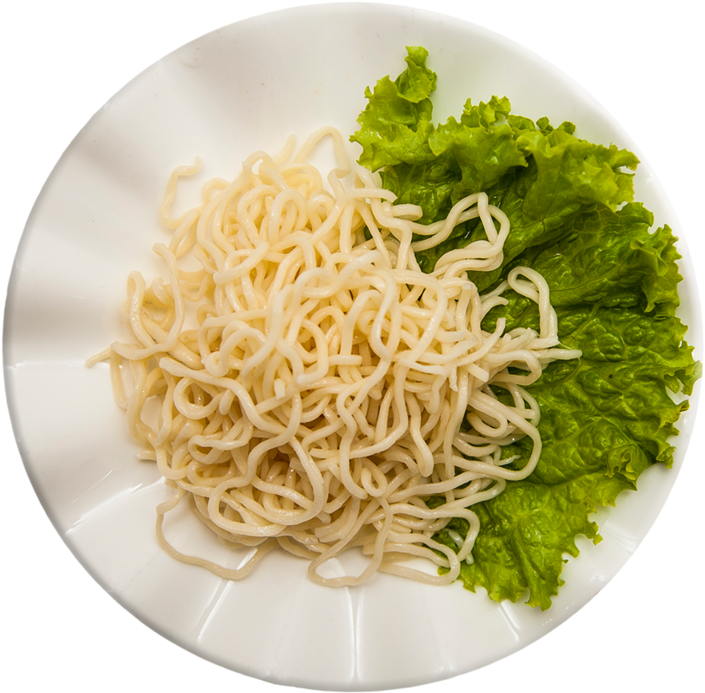 A Plate Of Noodles And Lettuce