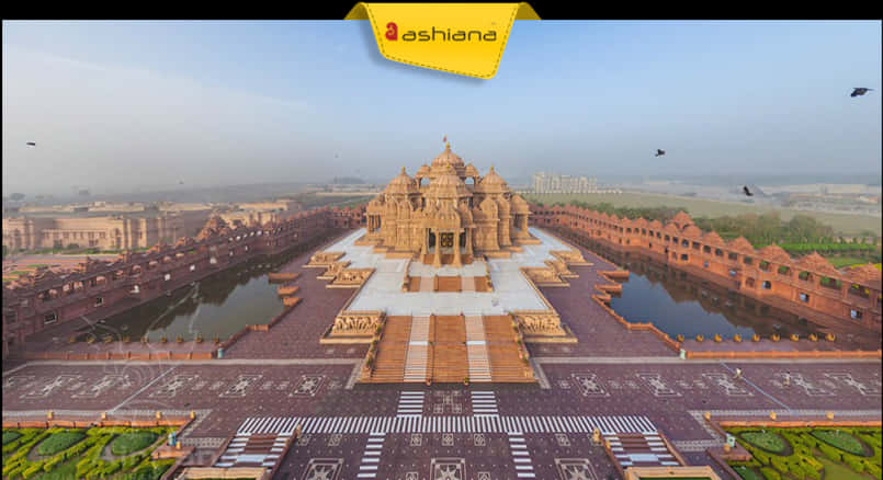 A Large Building With A Pool Of Water With Akshardham In The Background