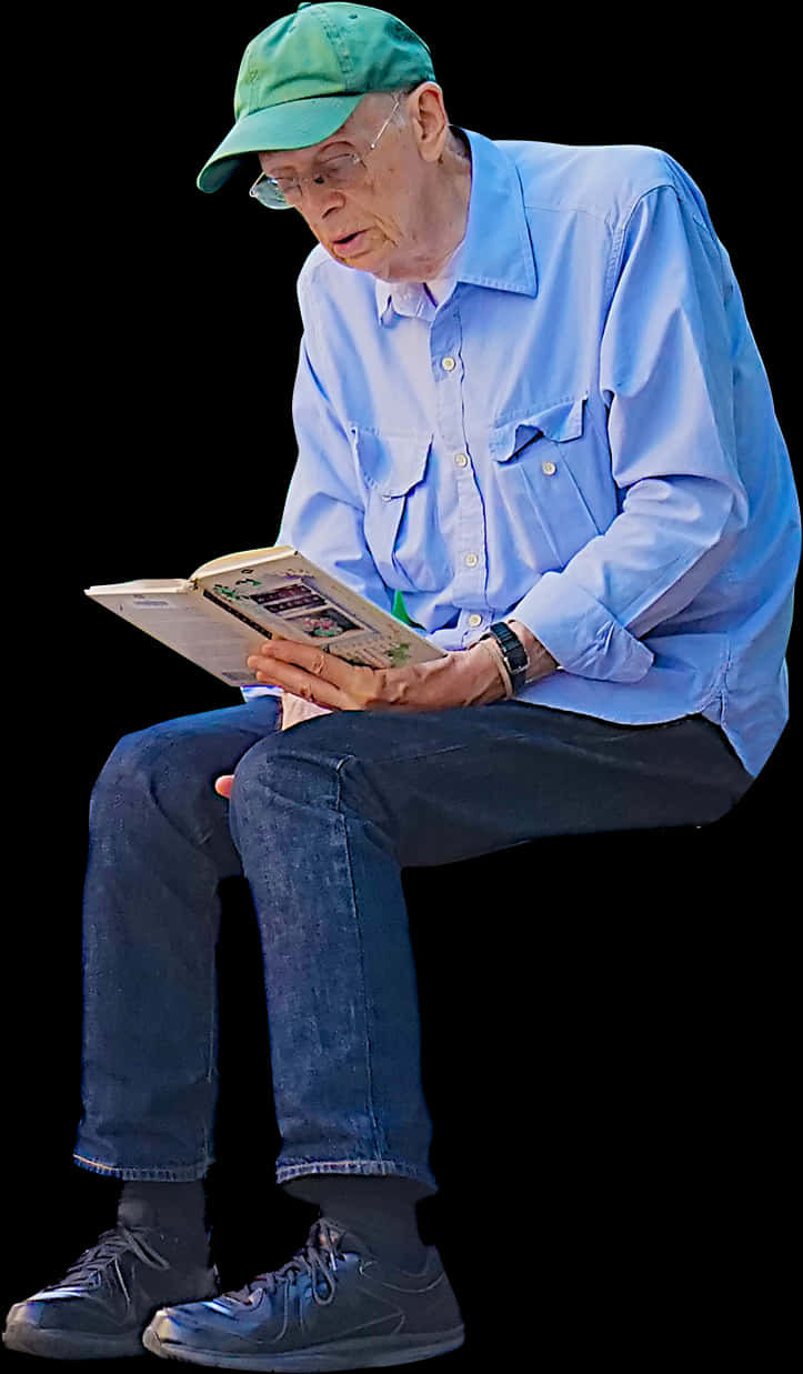 A Man Sitting And Reading A Book