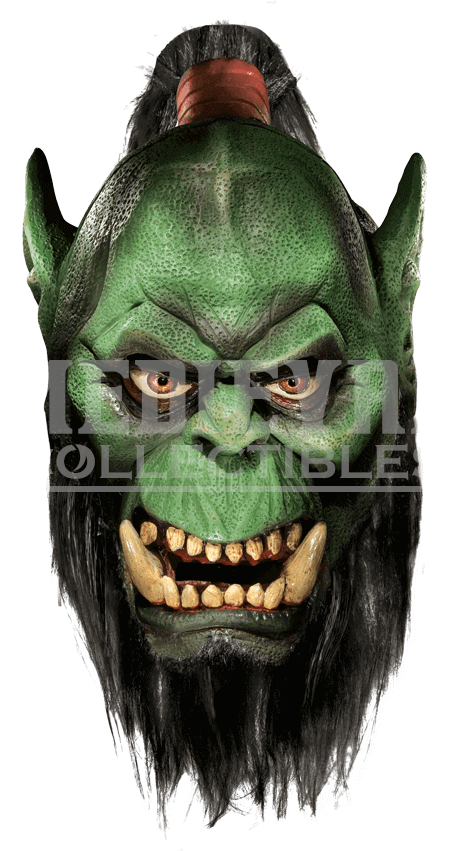 A Green Monster Mask With Sharp Teeth And Sharp Teeth