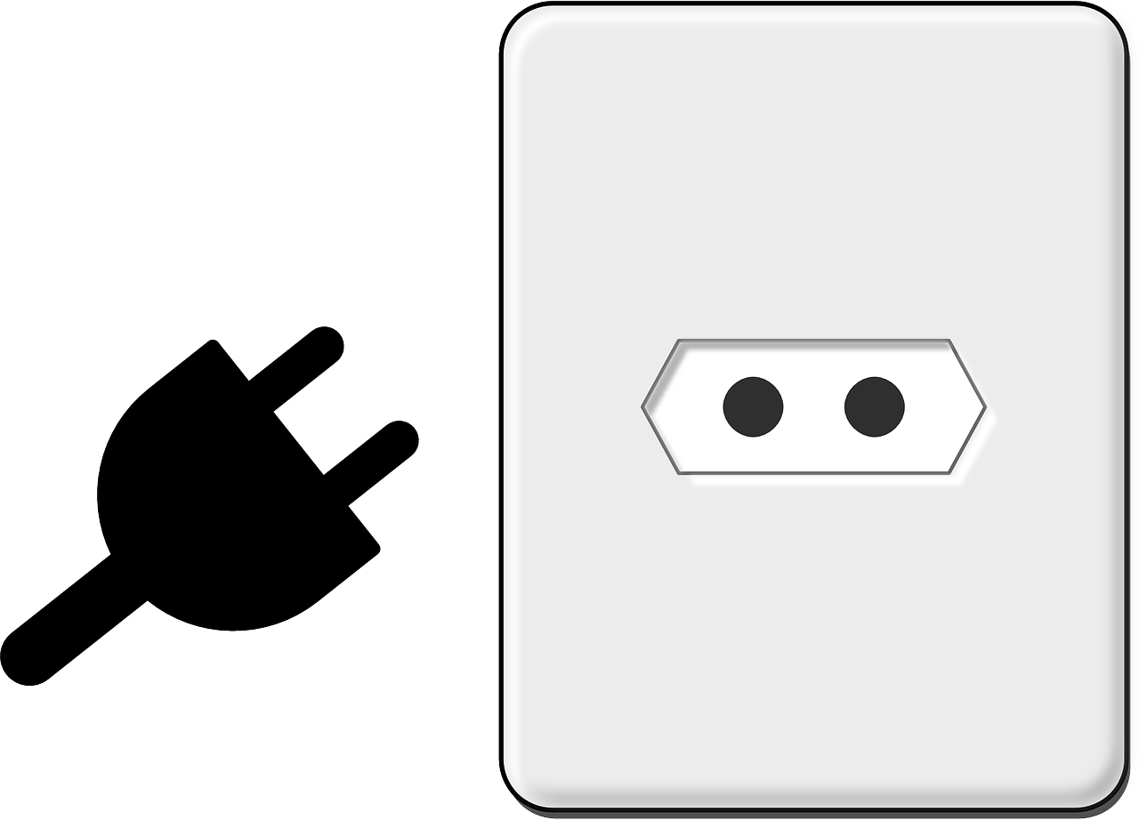 A White Rectangular Object With Black Dots