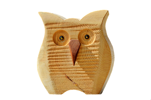 A Wooden Owl With A Pointed Beak