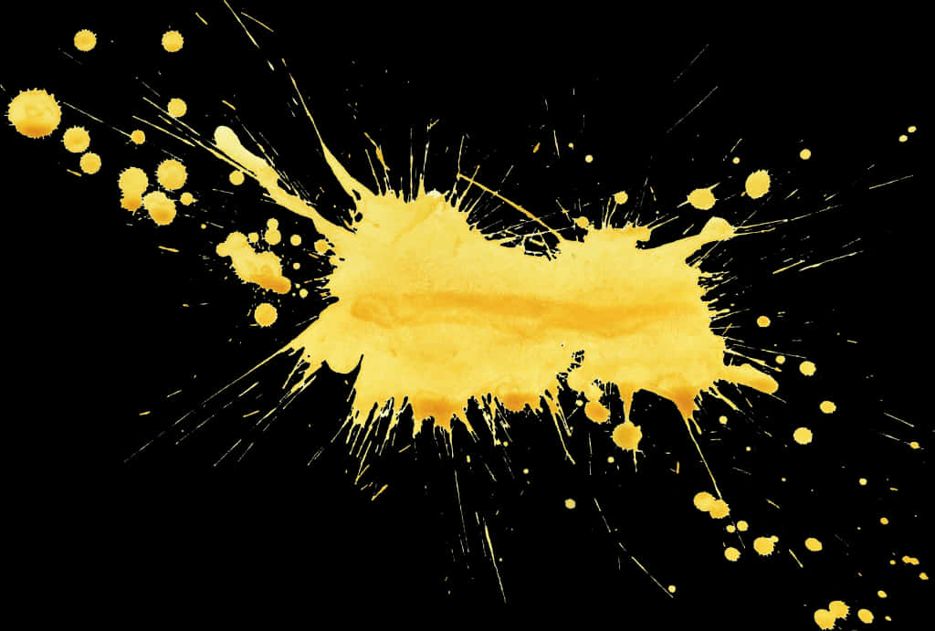 A Yellow Paint Splatter On A Black Background