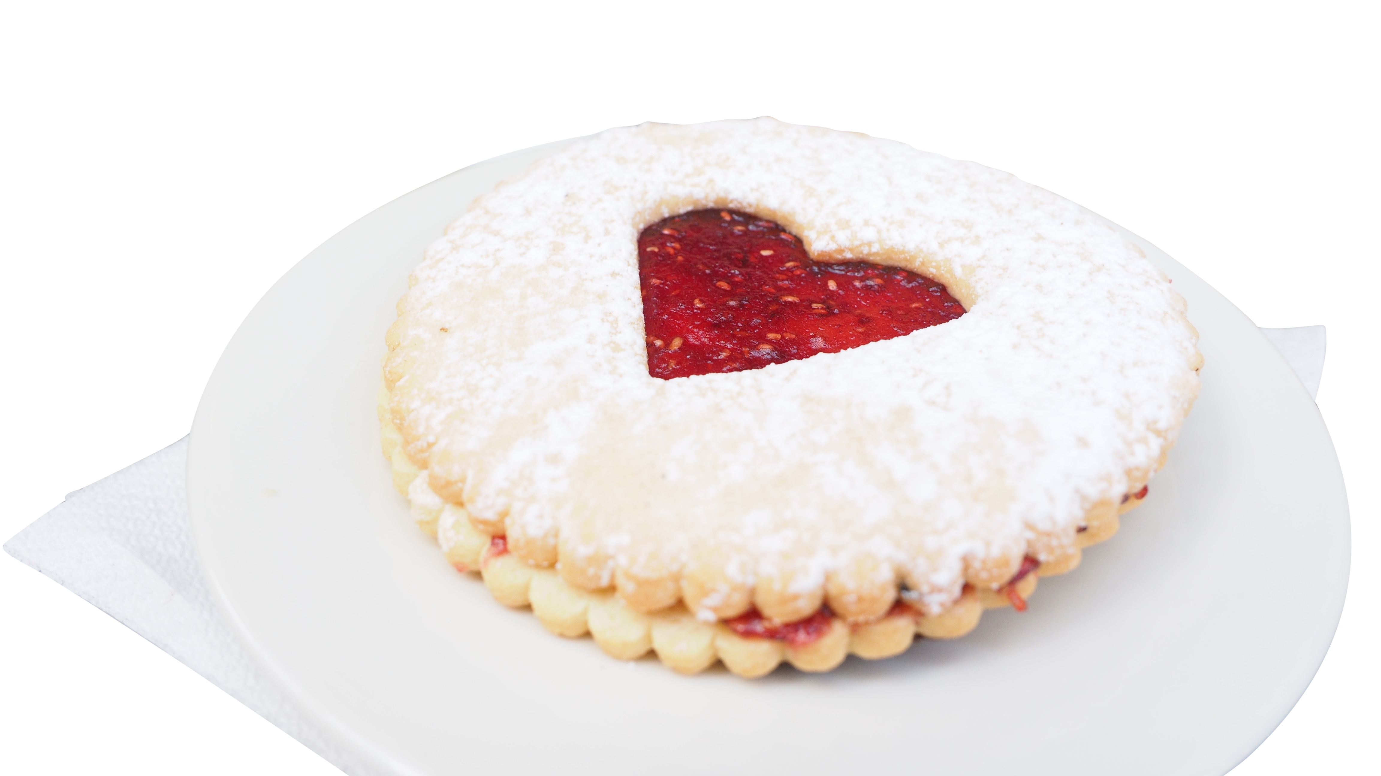 A Heart Shaped Cookie With A Jam Inside