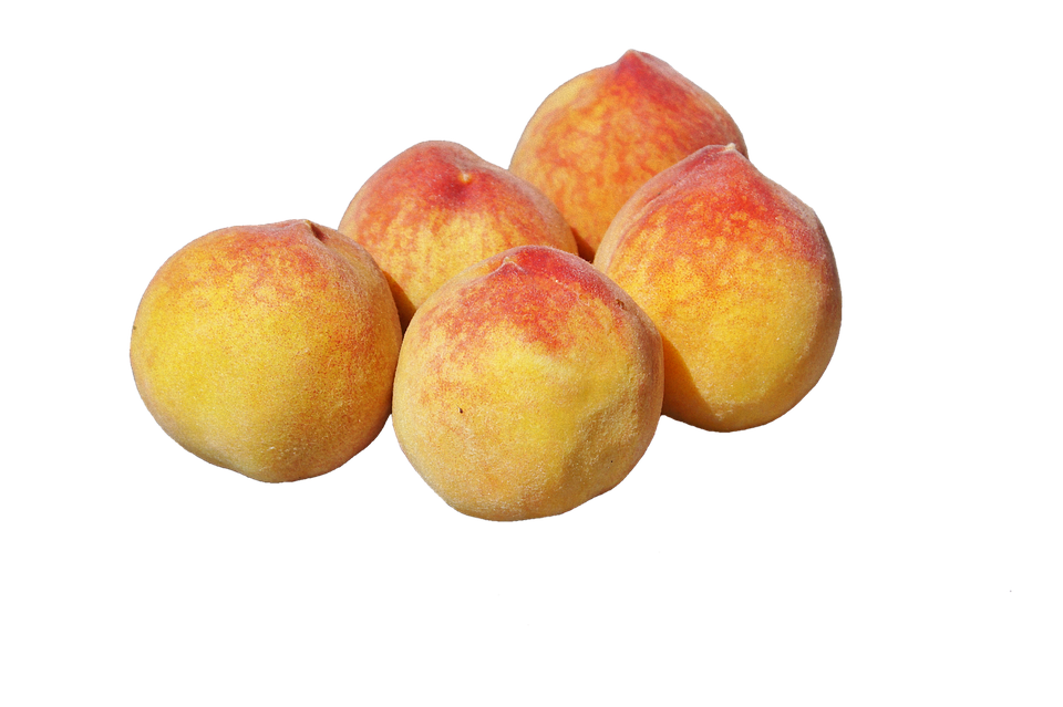 A Group Of Peaches On A Black Background