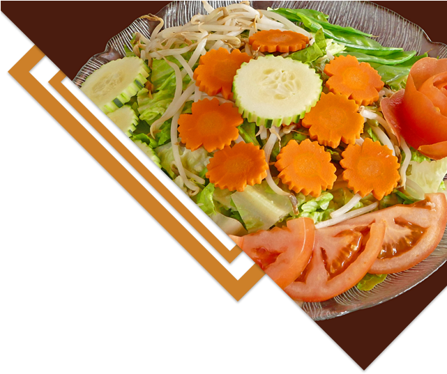 A Plate Of Vegetables On A Brown Background
