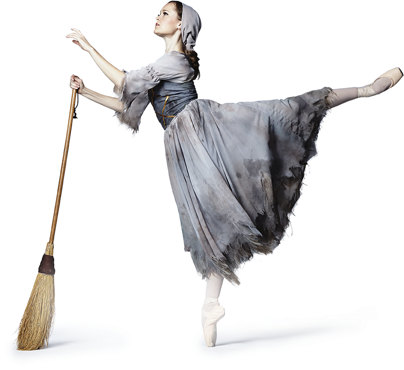 A Woman In A Dress And Pointe Shoes Holding A Broom