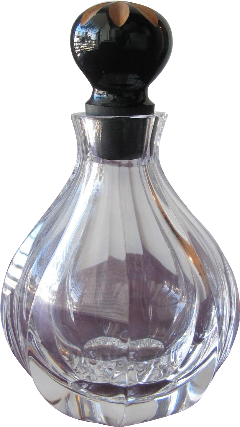 A Clear Glass Bottle With A Black Top
