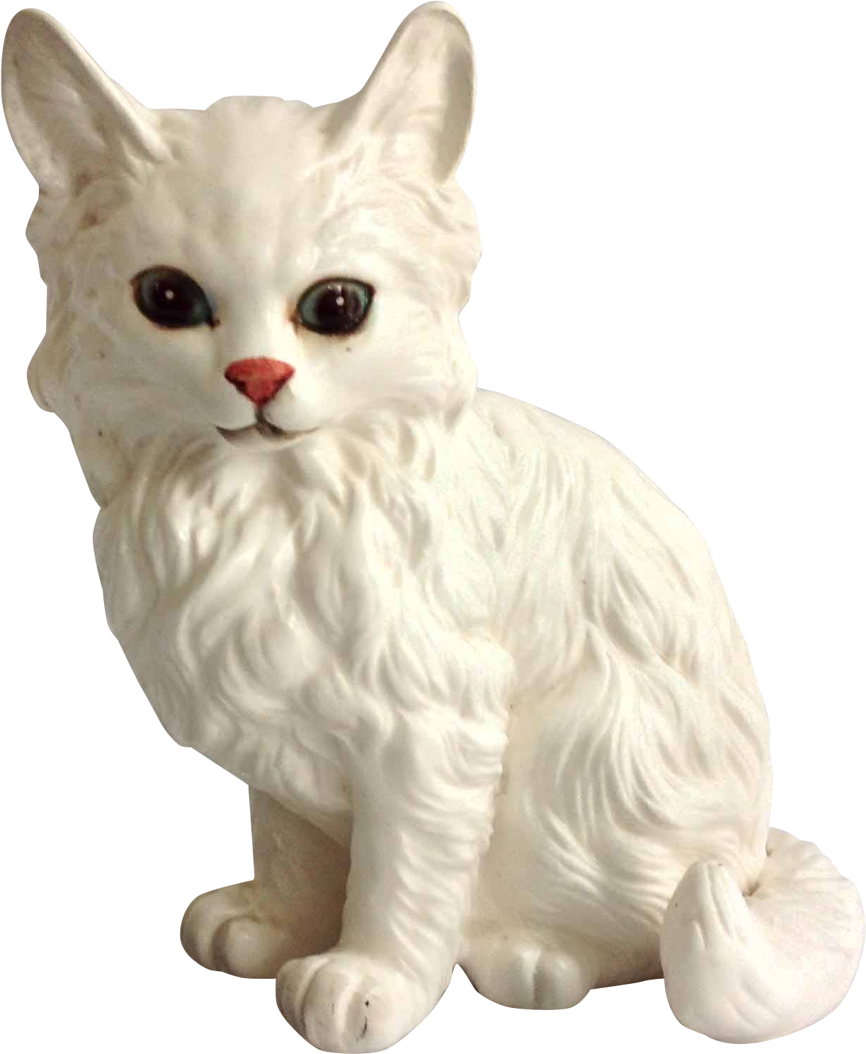 A White Cat Statue With A Red Nose