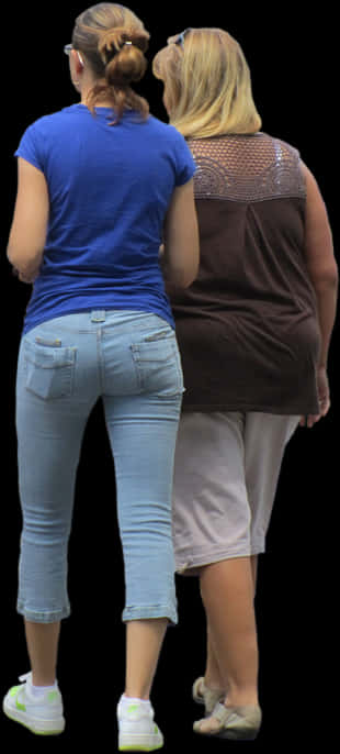 Two Women Standing Next To Each Other