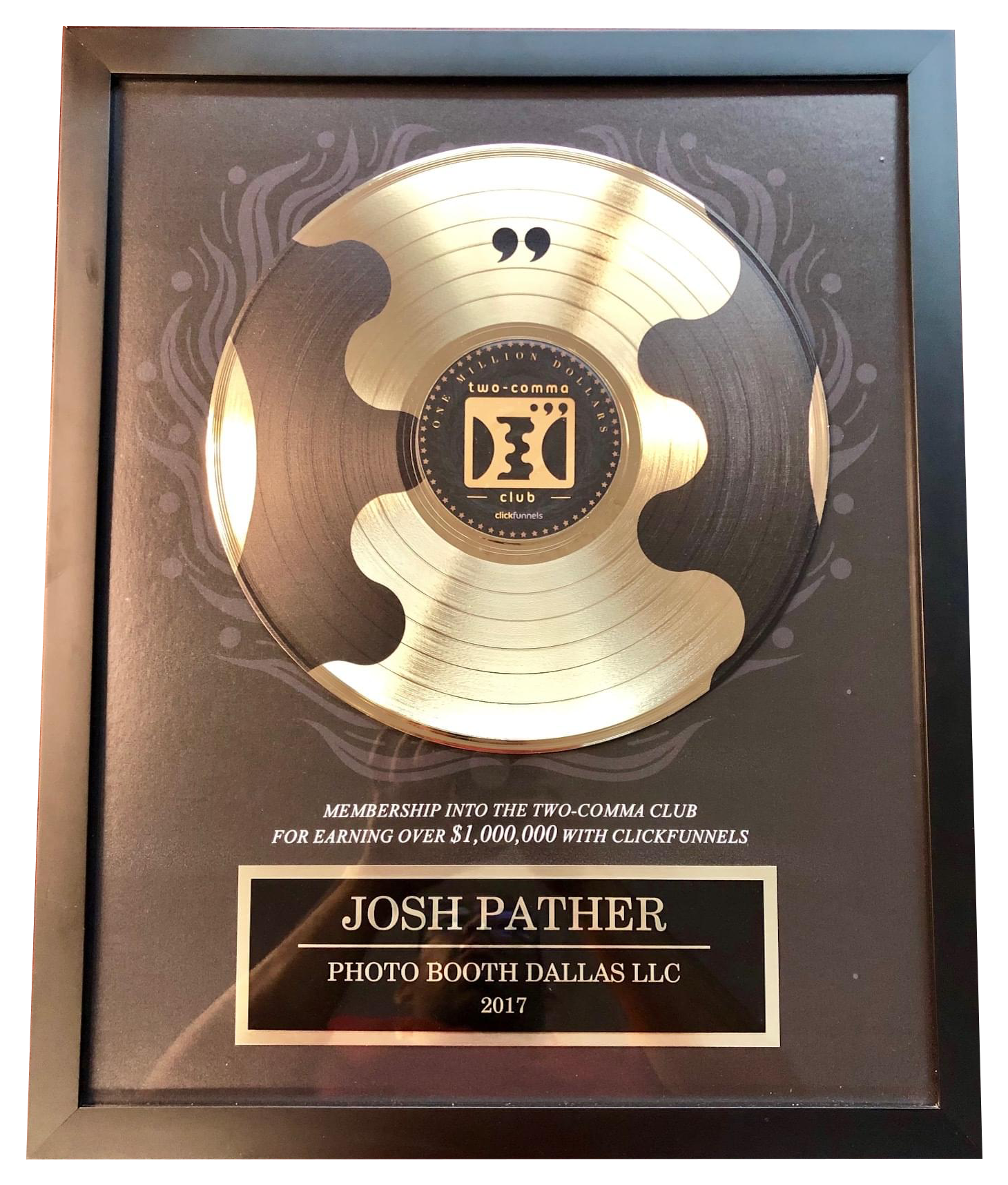 A Gold And Black Record In A Frame
