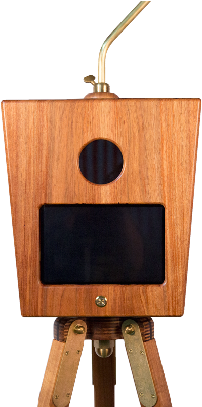 A Wooden Plaque With A Black Circle