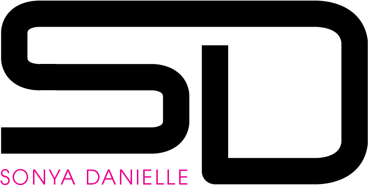 A Black Background With Pink Text