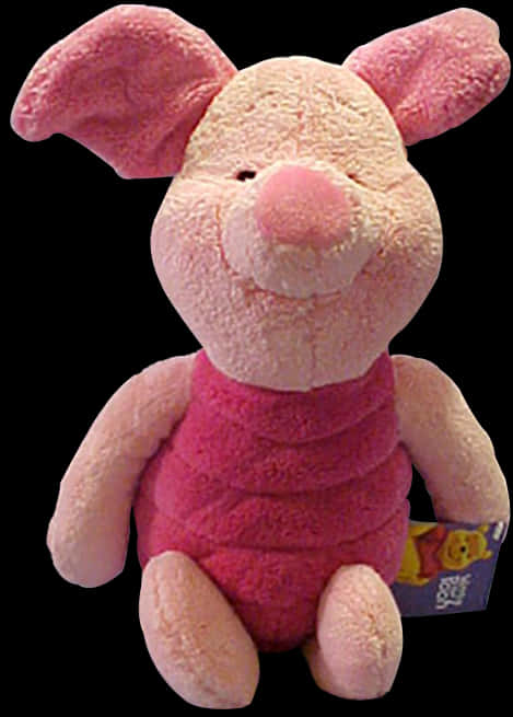A Pink Stuffed Animal On A Black Background