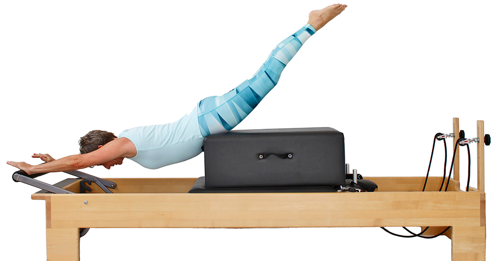 A Woman Doing A Pilates Exercise On A Pilates Machine