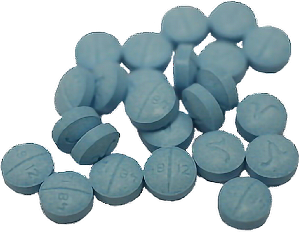 A Group Of Pills On A Black Background