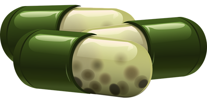 Close-up Of A Green And White Capsule