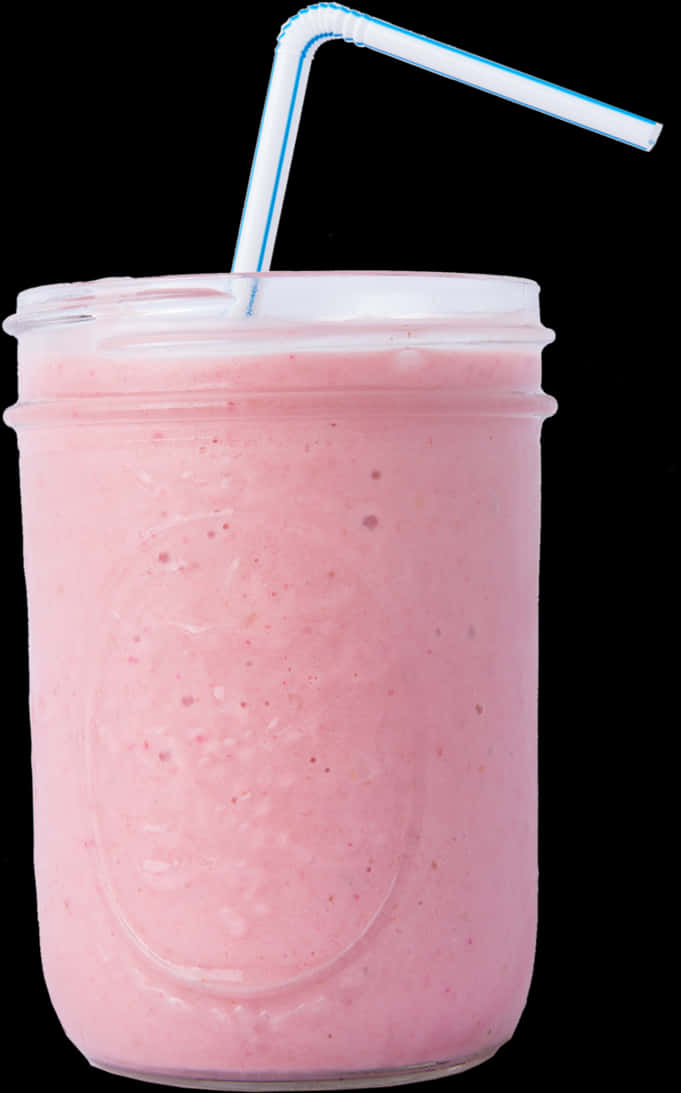 A Pink Smoothie In A Glass With A Straw