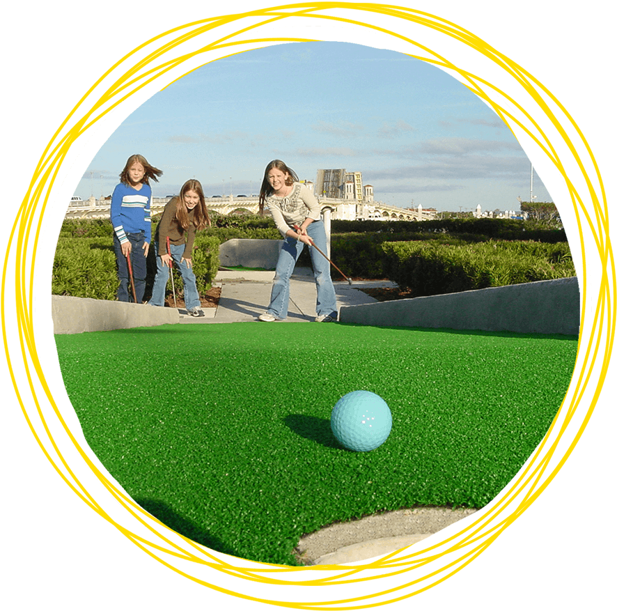 A Group Of Girls Playing Mini Golf