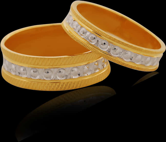 A Pair Of Gold Rings With Diamonds