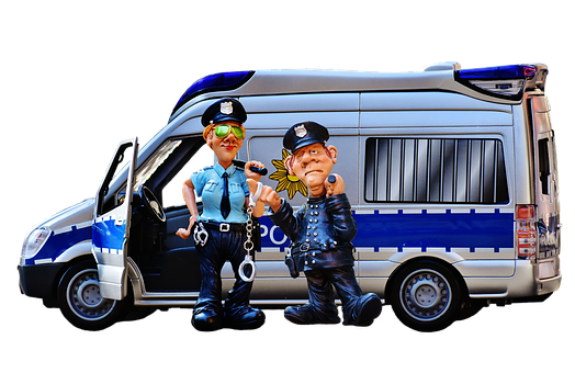 Two Police Officers Standing Next To A Van