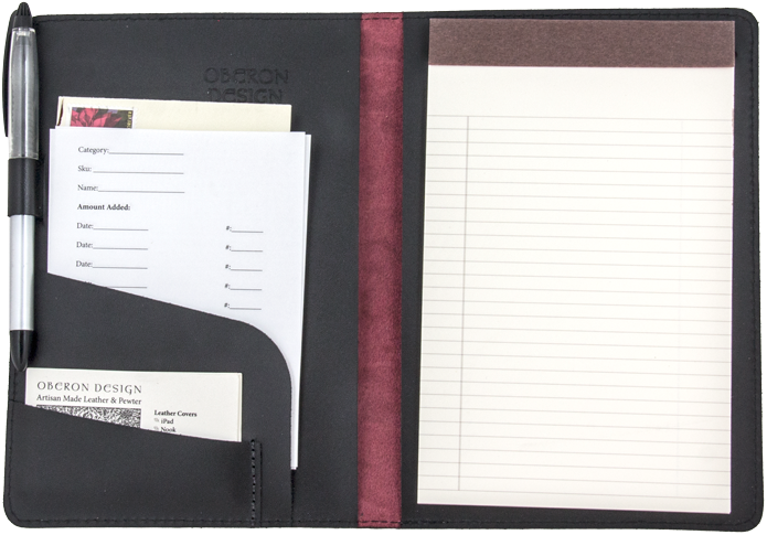 A Black Folder With White Paper Inside