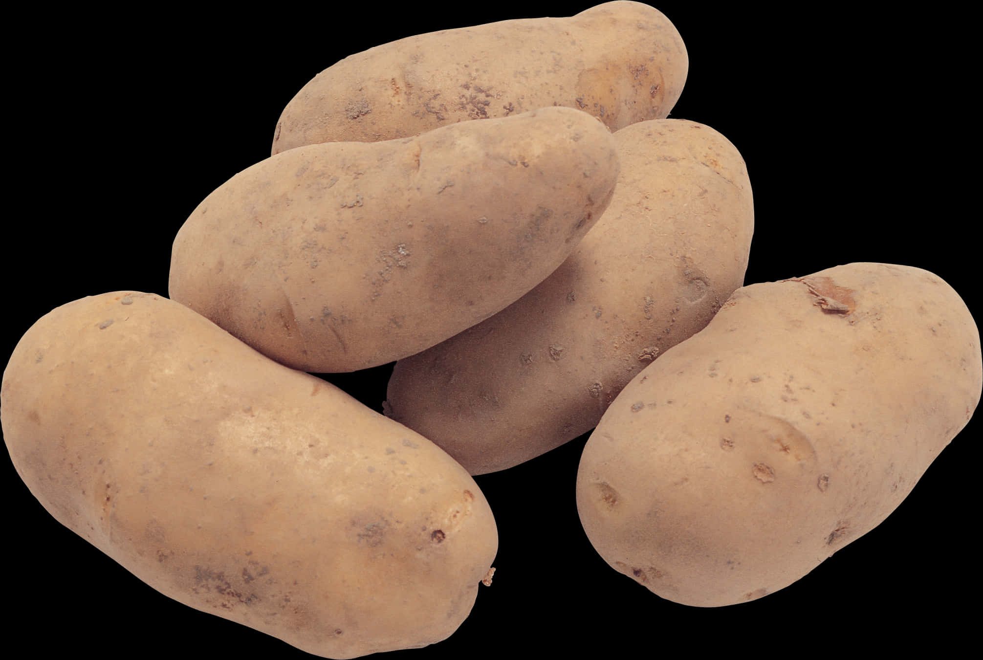A Group Of Potatoes On A Black Background
