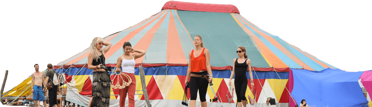 A Group Of Women Standing In Front Of A Circus Tent