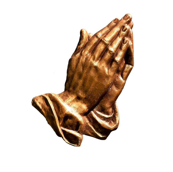 A Statue Of A Praying Hands