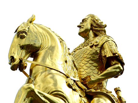 A Gold Statue Of A Man Riding A Horse