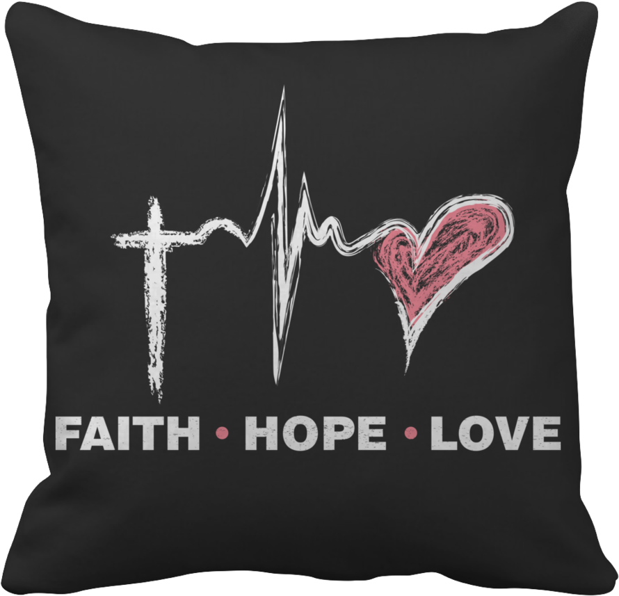 A Black Pillow With A Heart And A Cross On It
