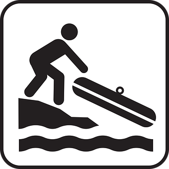 A Sign With A Person Pushing A Sled