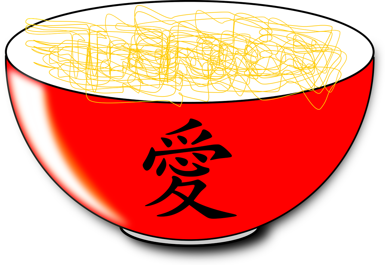 A Red Bowl With Noodles In It