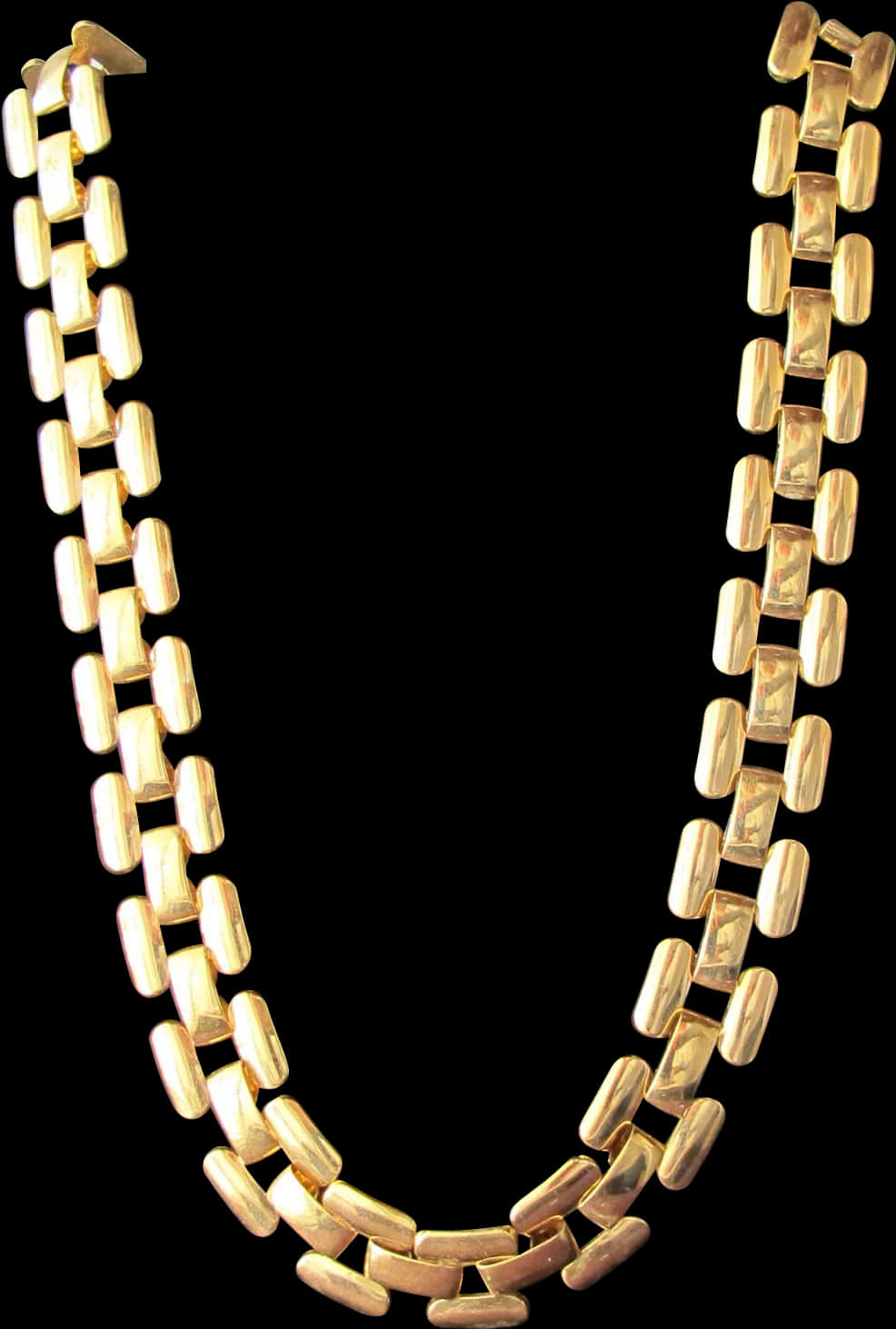A Gold Necklace On A Black Background