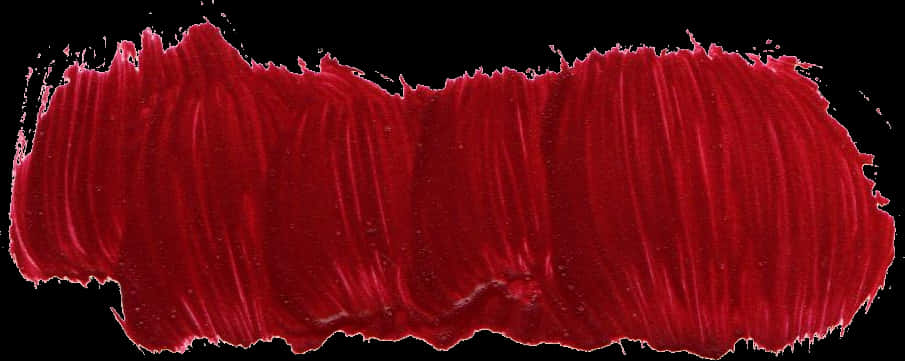 A Red Paint Smear On A Black Background
