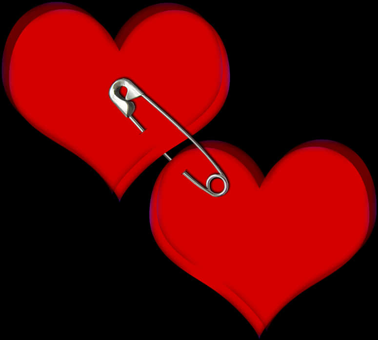 A Heart Shaped Objects With A Safety Pin