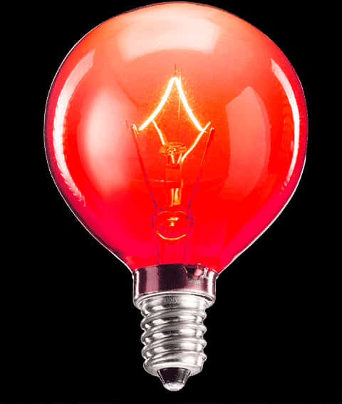 A Red Light Bulb With A Black Background