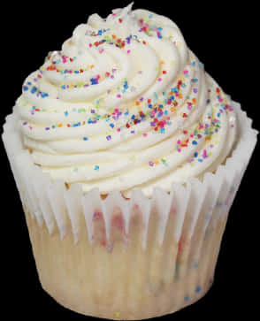 A Cupcake With White Frosting And Sprinkles