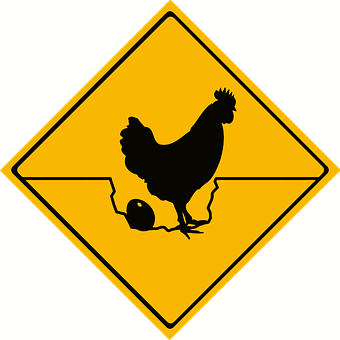 A Yellow Sign With A Silhouette Of A Chicken
