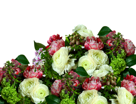 A Bouquet Of Flowers With Green Leaves