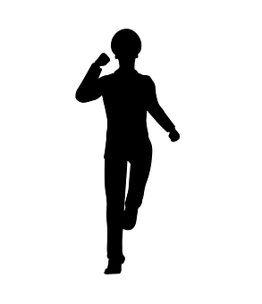 A Silhouette Of A Man Holding A Ball