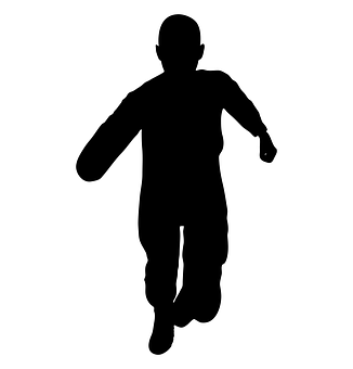 A Silhouette Of A Boy Running