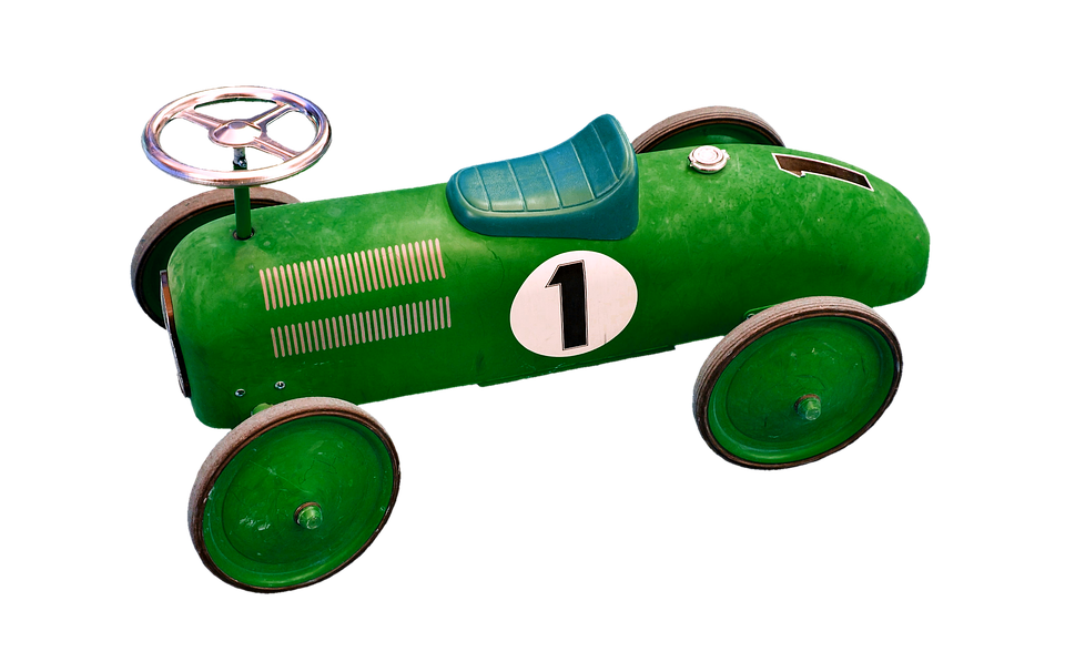 A Green Toy Car With Wheels