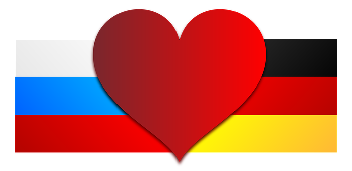 A Heart Shaped Red And Blue And Yellow Stripes