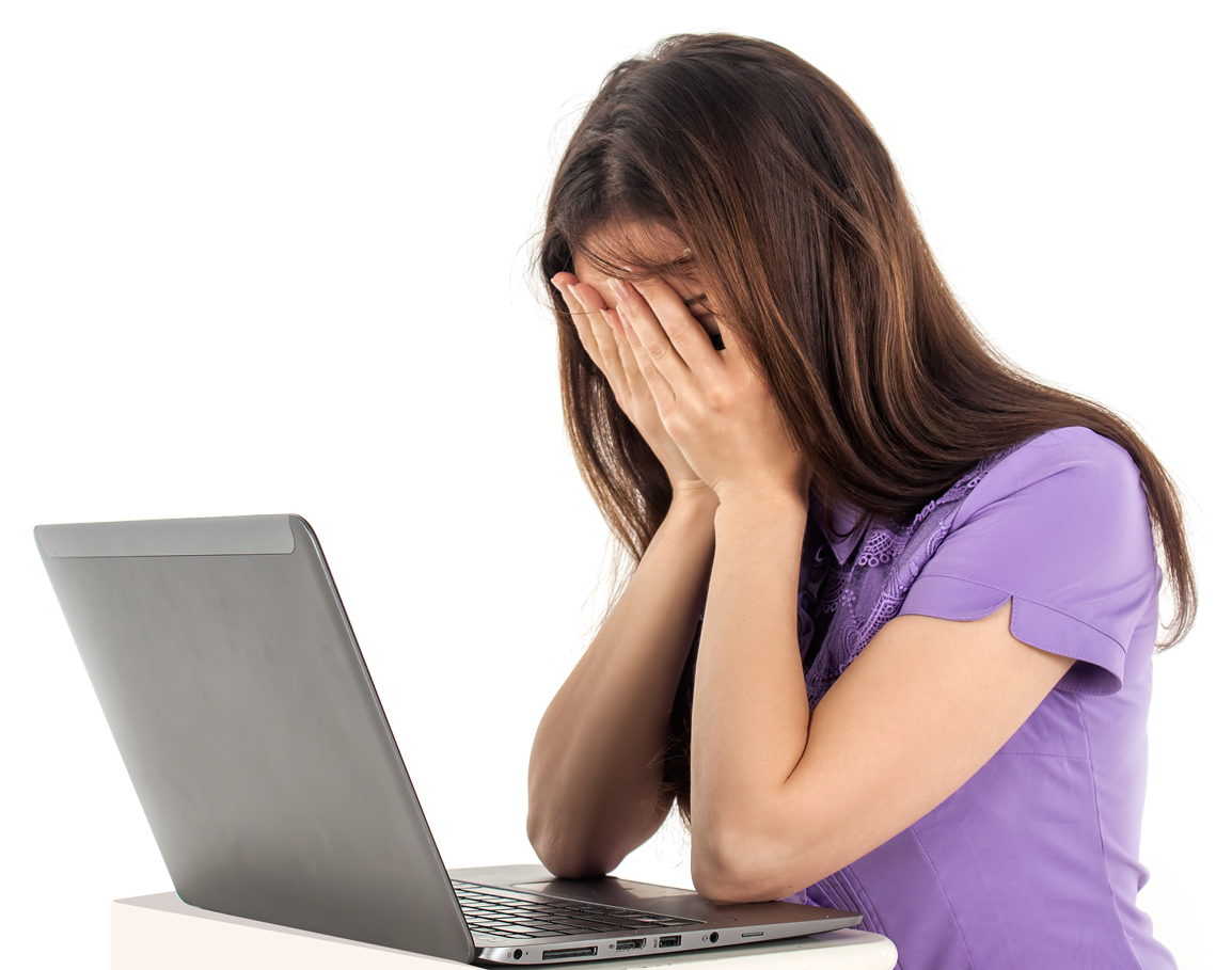 A Woman With Her Hands Over Her Face Looking At A Laptop
