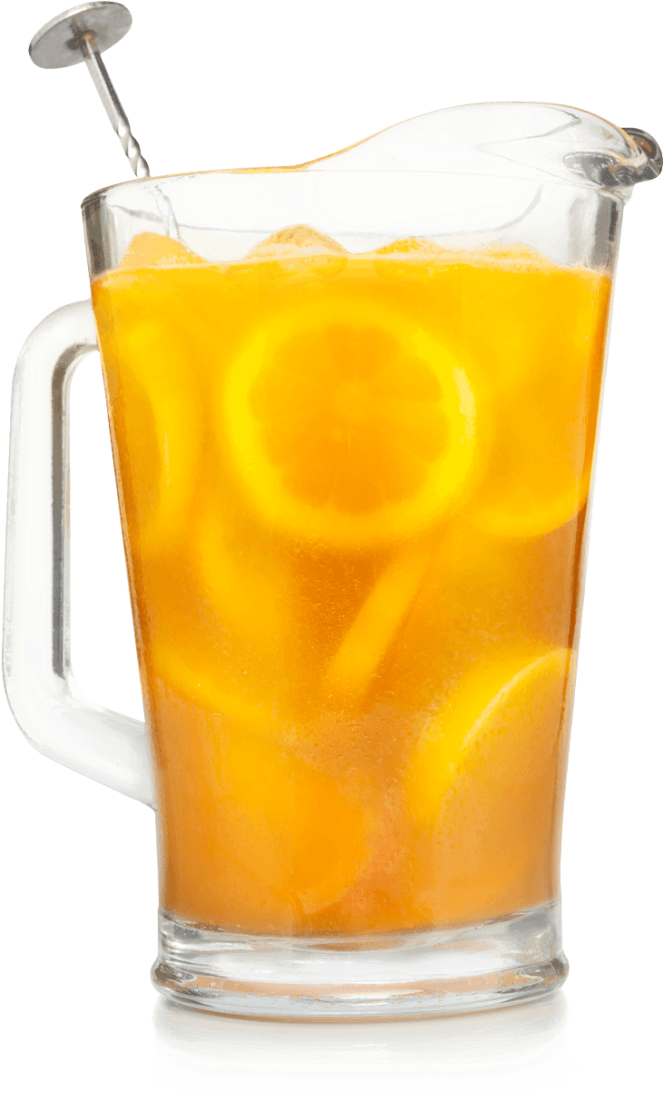 A Glass Cup With Orange Liquid And Lemon Slices
